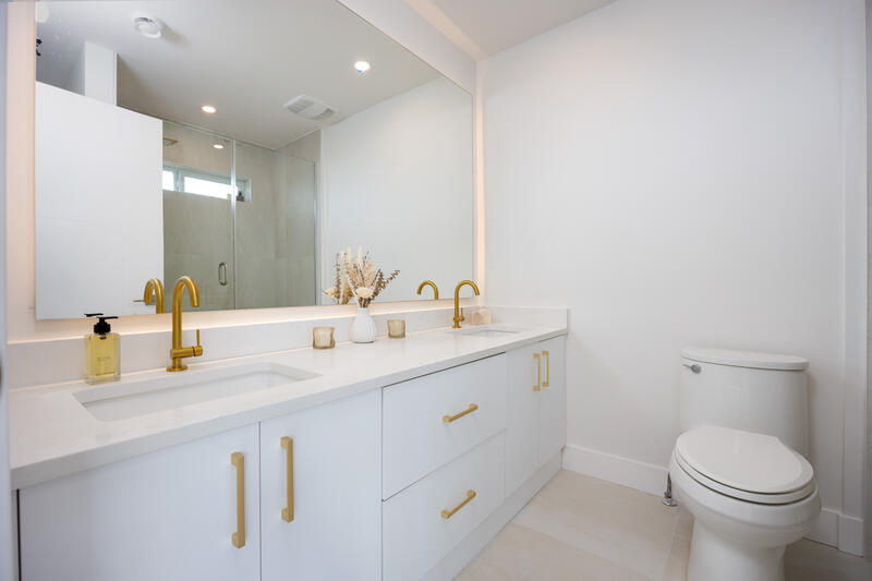 Ensuite with gold fixtures and double vanity