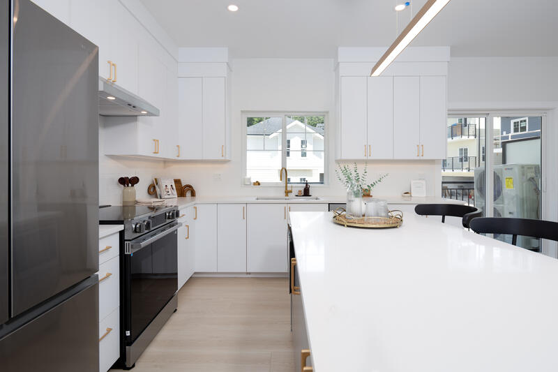 Light scheme kitchen with white cabinets and gold hardware